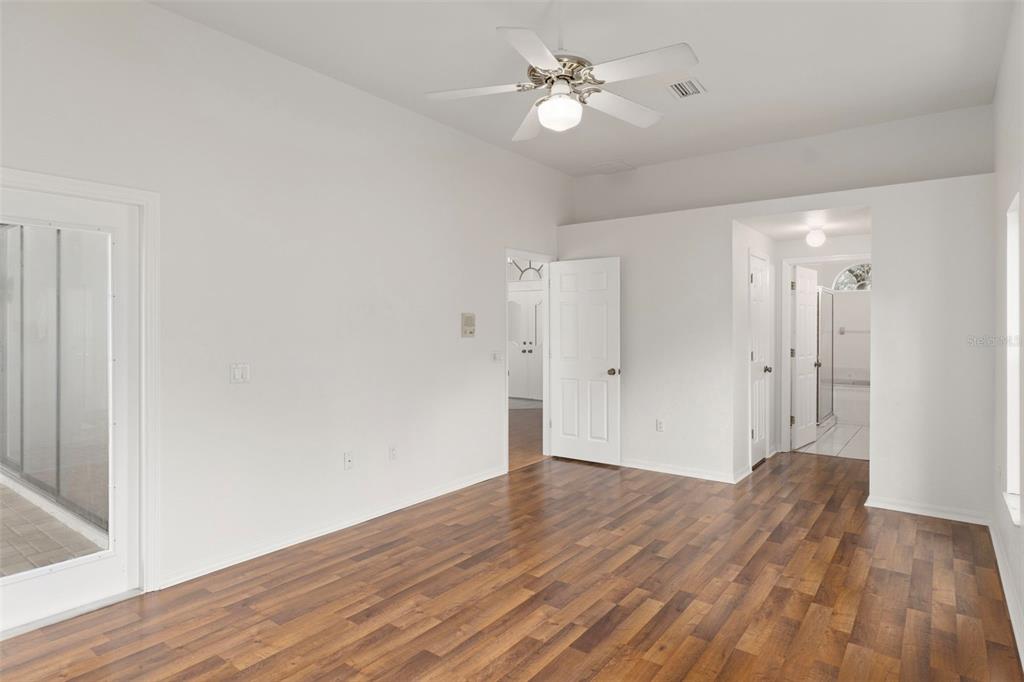 2214 Meadow Lark Road Spring Hill, FL 34608 - Photo 22 of 49 a view of empty room with wooden floor