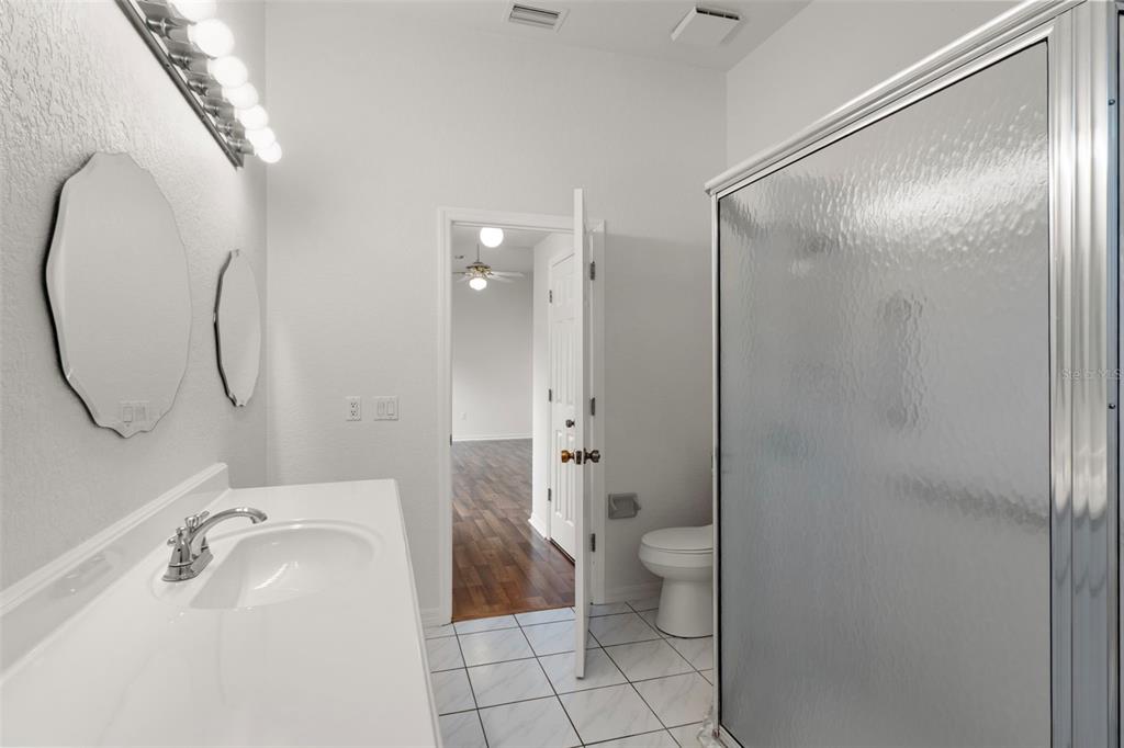 2214 Meadow Lark Road Spring Hill, FL 34608 - Photo 27 of 49 a bathroom with a sink toilet and shower