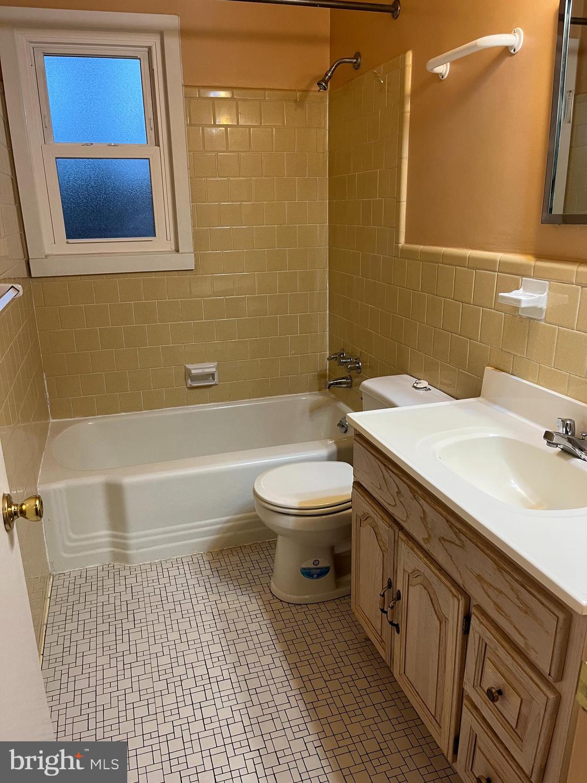 3109 Northbrook Road Baltimore, MD 21208 - Photo 14 of 23 a bathroom with a sink a toilet and shower