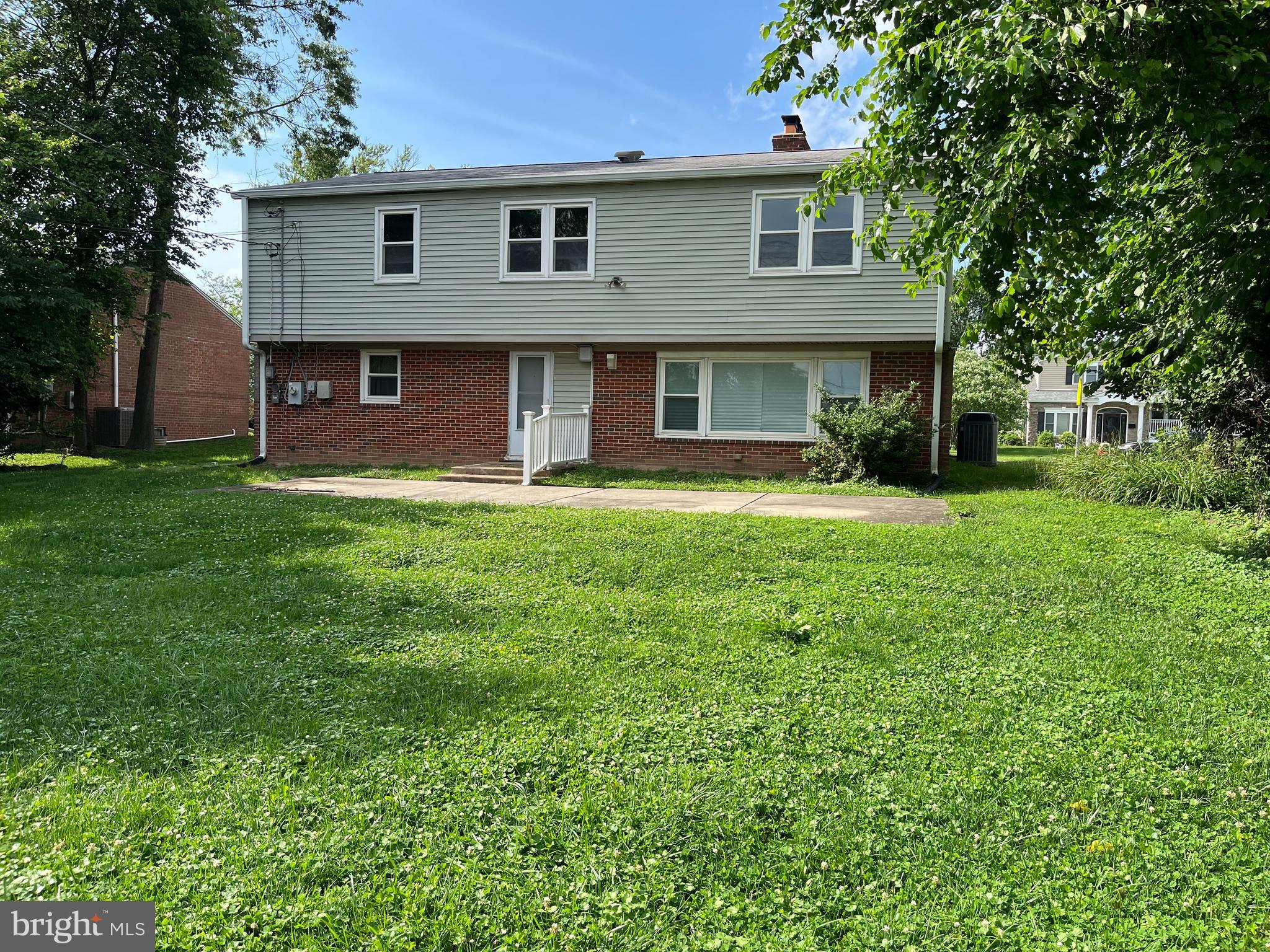 3109 Northbrook Road Baltimore, MD 21208 - Photo 22 of 23 a front view of a house with a yard and trees