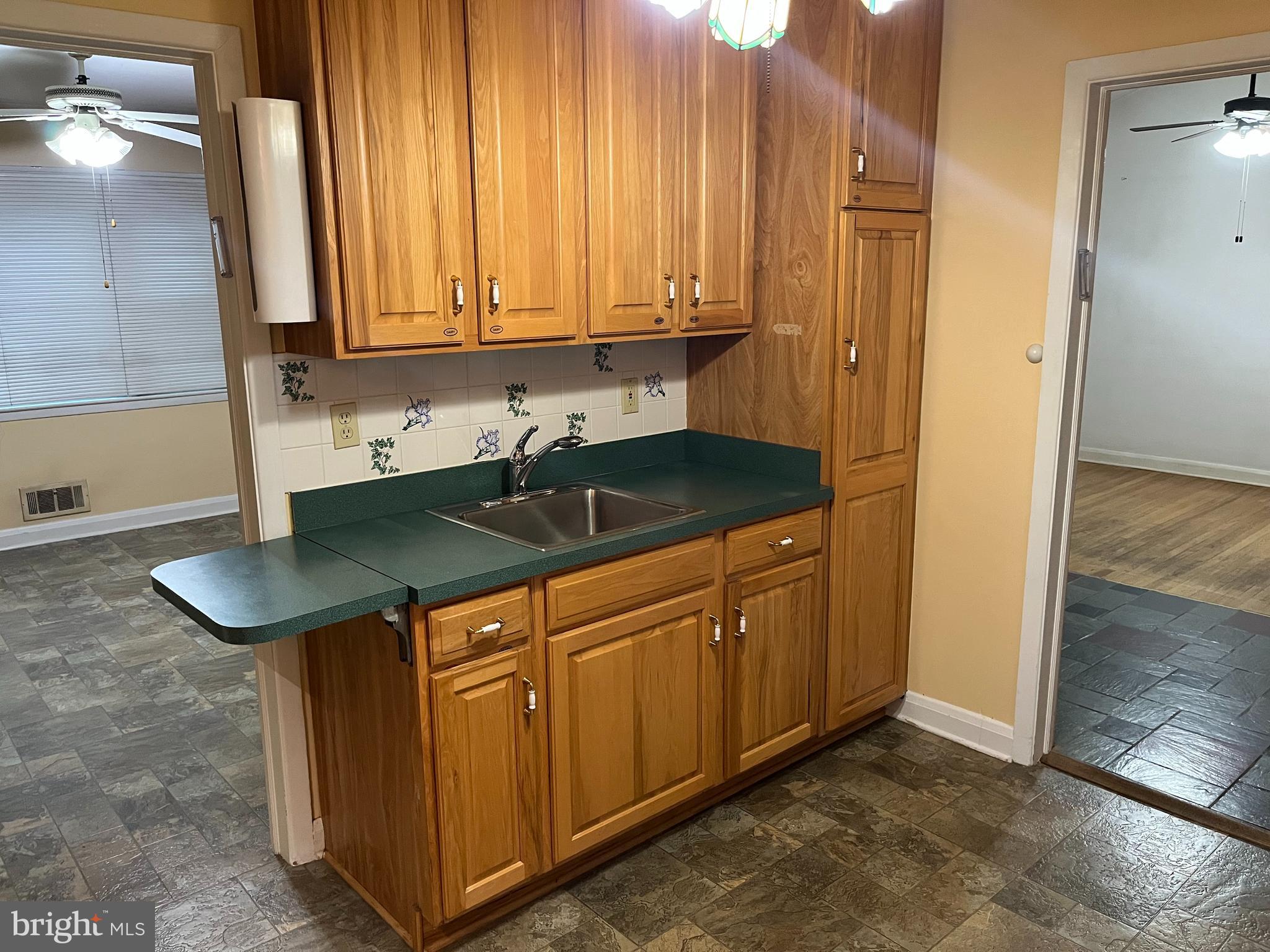 3109 Northbrook Road Baltimore, MD 21208 - Photo 7 of 23 a kitchen with stainless steel appliances granite countertop a sink and a cabinets
