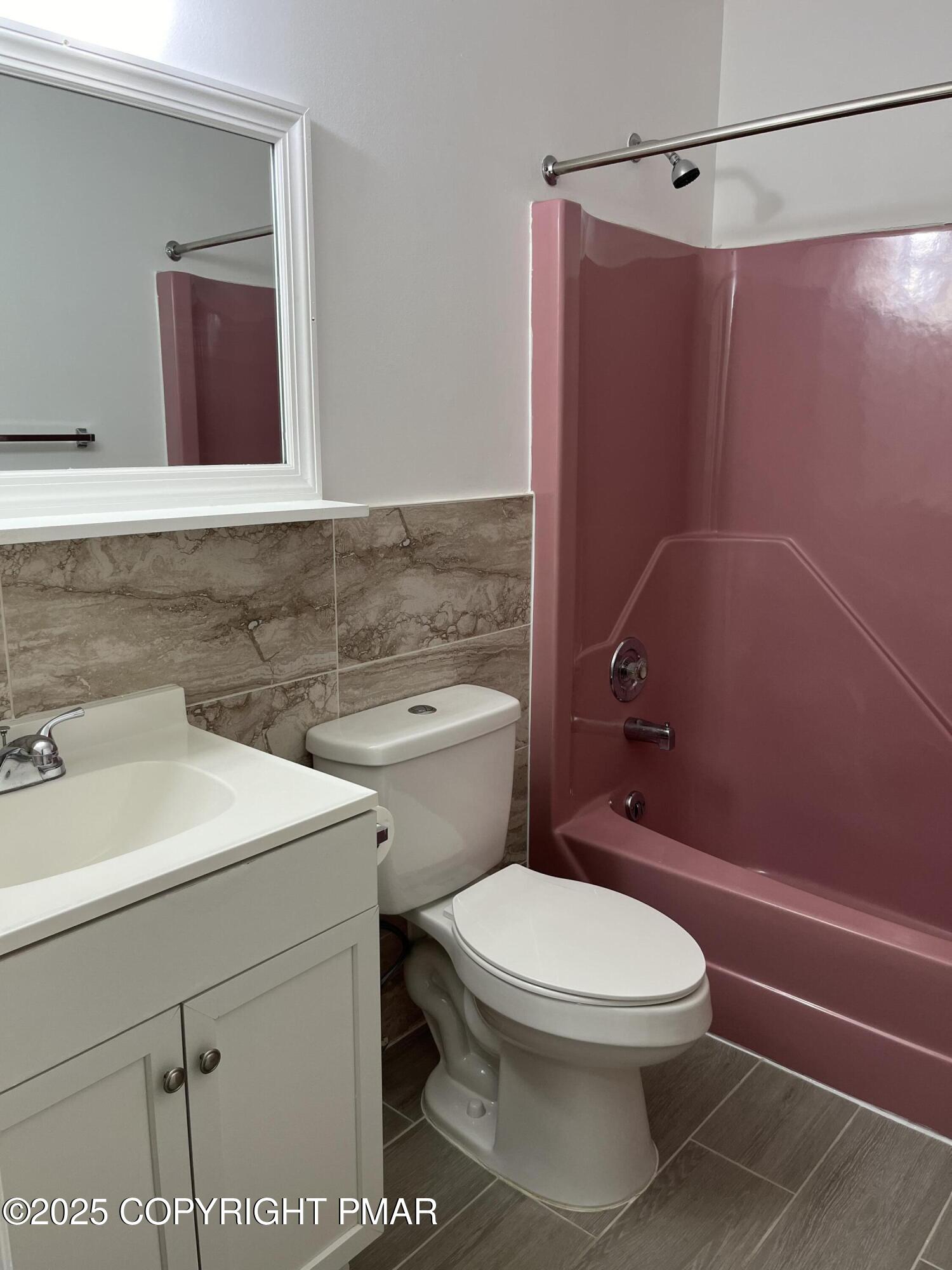 5031 Woodbridge Drive East Bushkill, PA 18324 - Photo 11 of 17 a bathroom with a sink a toilet and shower