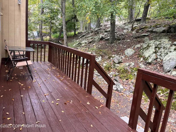 a view of a balcony with wooden floor