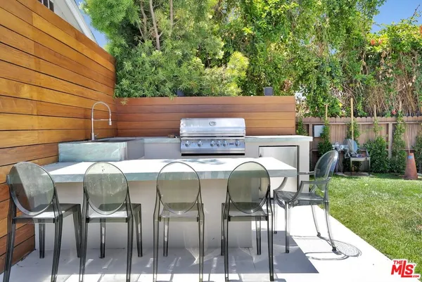 a view of outdoor dining space with a patio