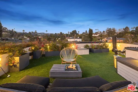 a view of a building with a yard