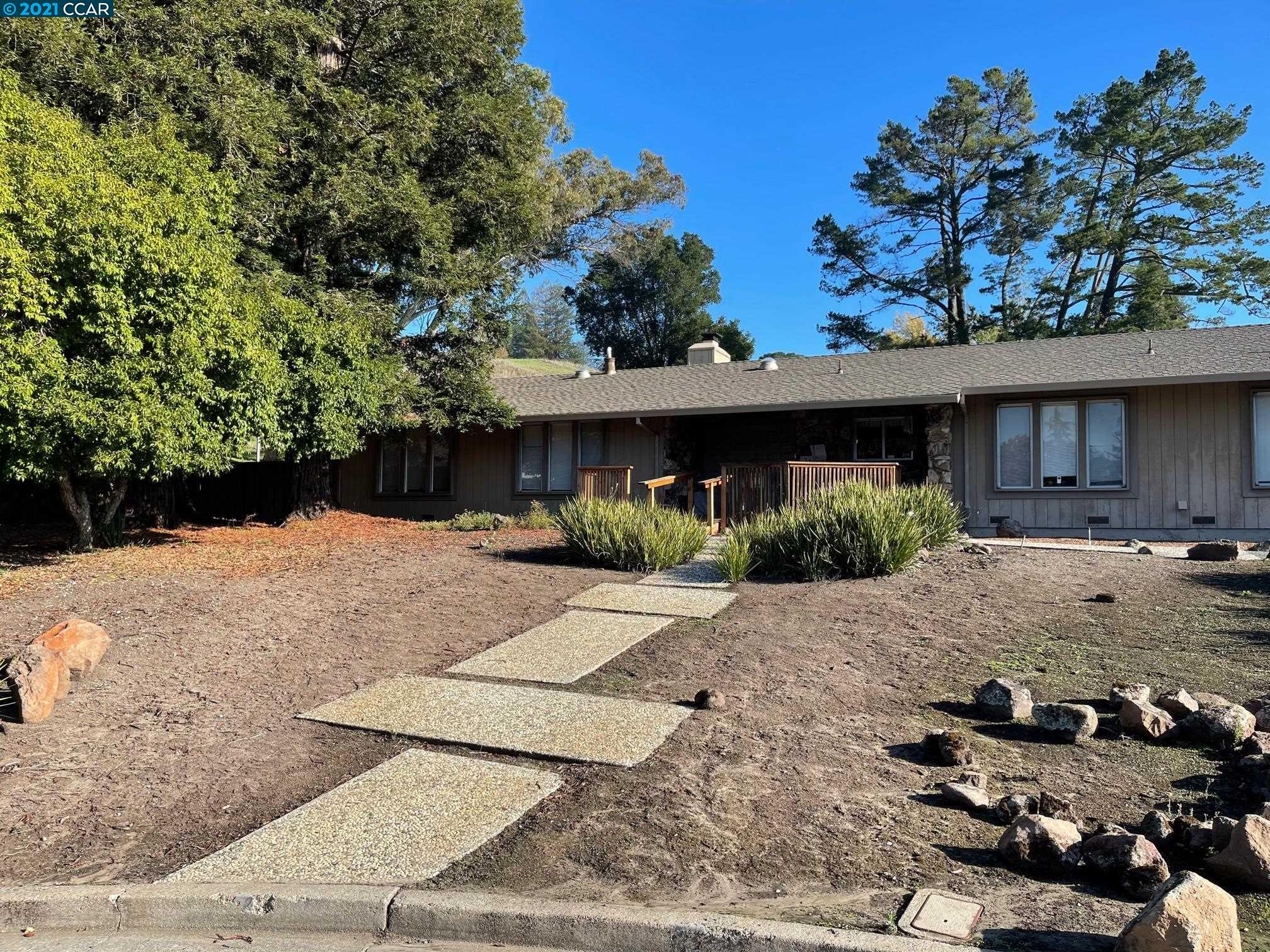 Undisclosed Address Moraga, CA 94556 - Photo 1 of 1 a front view of a house with a yard
