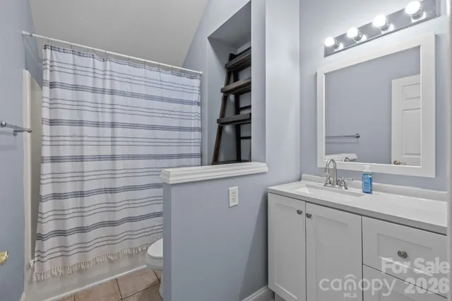 a view of room with stairs and a window