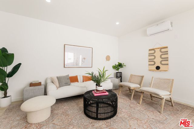 a flower room with furniture and a potted plant