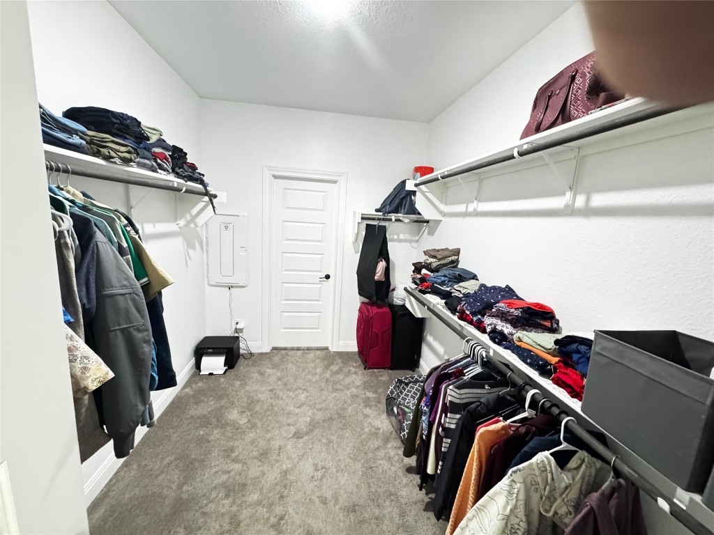 302 Georgia Lace Trail Georgetown, TX 78626 - Photo 11 of 21 a view of walk in closet with clothes and shoes