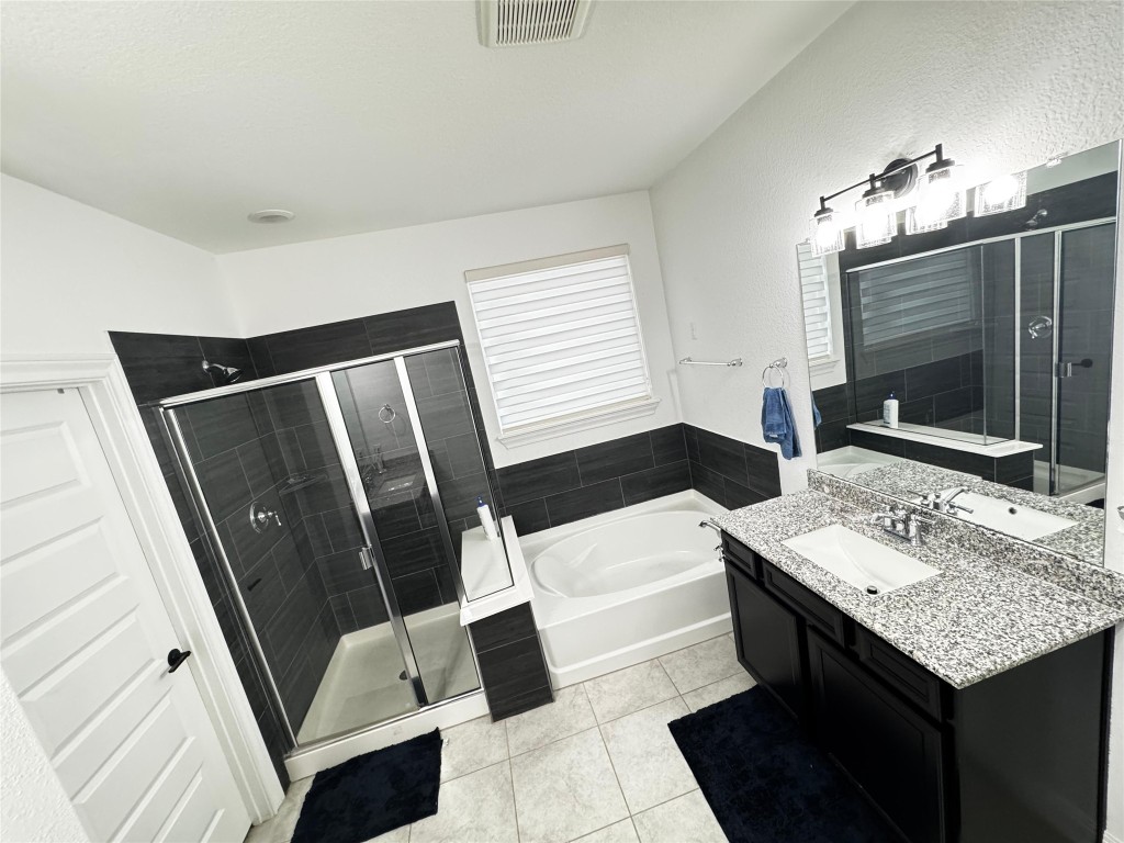 302 Georgia Lace Trail Georgetown, TX 78626 - Photo 18 of 21 a bathroom with a sink a mirror and a toilet