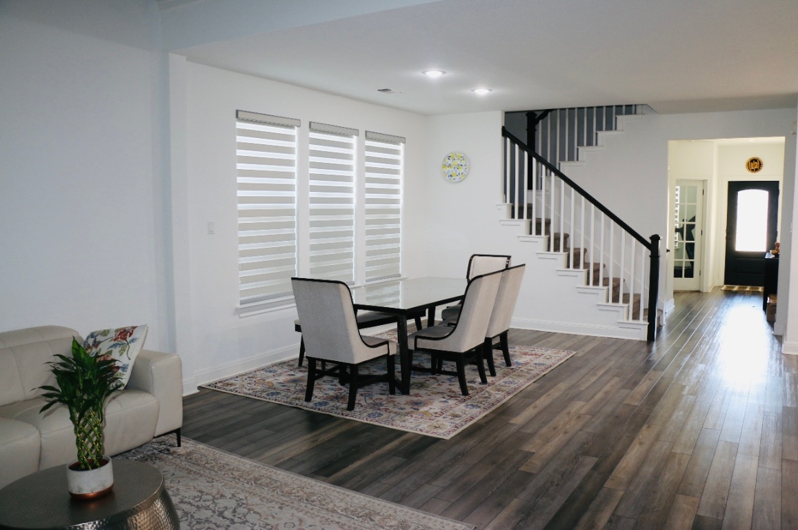 302 Georgia Lace Trail Georgetown, TX 78626 - Photo 10 of 21 a view of a dining room with furniture window and wooden floor