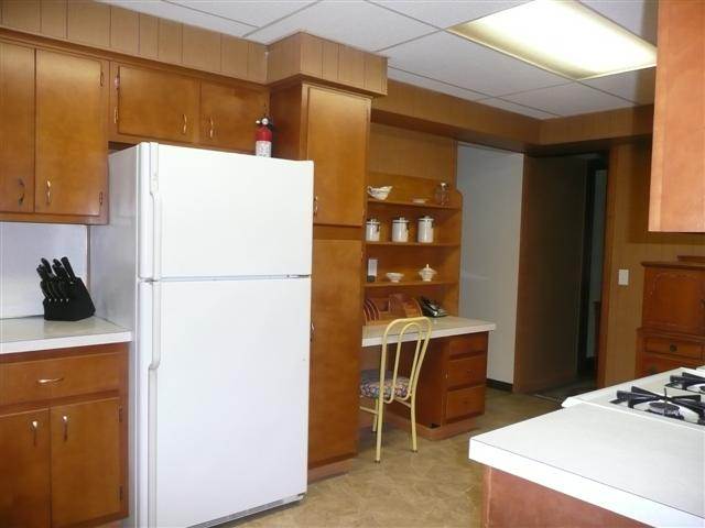 2959 West Red Oak Road Freeport, IL 61032 - Photo 5 of 9 a kitchen with a refrigerator a stove and a refrigerator