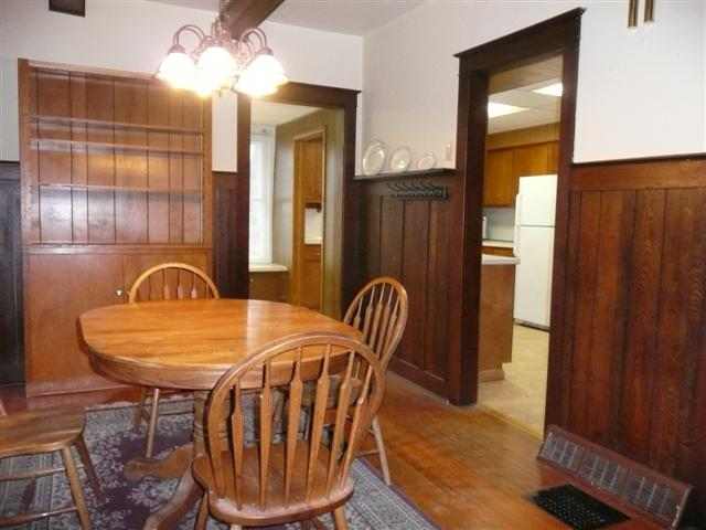 2959 West Red Oak Road Freeport, IL 61032 - Photo 6 of 9 a view of a dining room with furniture window and wooden floor