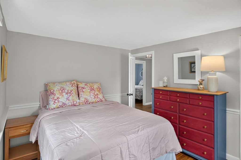 50 Pine Ridge Road Chatham, MA 02633 - Photo 26 of 42 a bedroom with a bed and a mirror