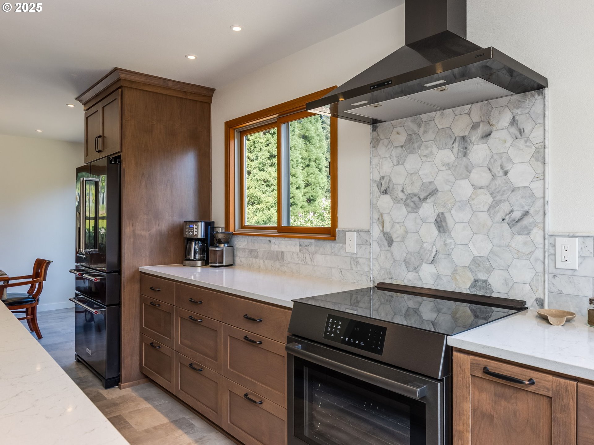 12720 South Carus Road Oregon City, OR 97045 - Photo 11 of 41 a kitchen with a sink stove and cabinets