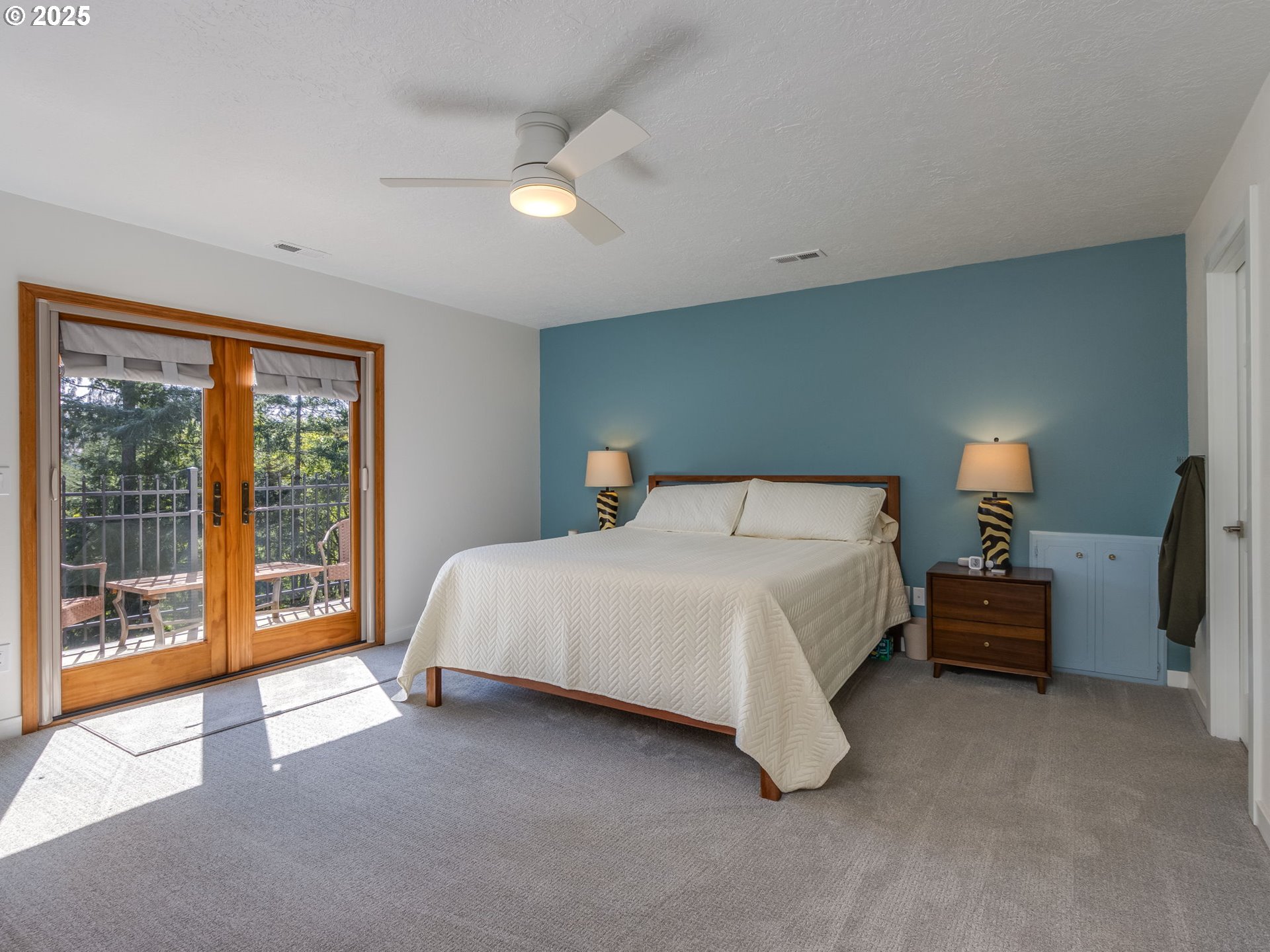 12720 South Carus Road Oregon City, OR 97045 - Photo 14 of 41 a bedroom with bed and large window