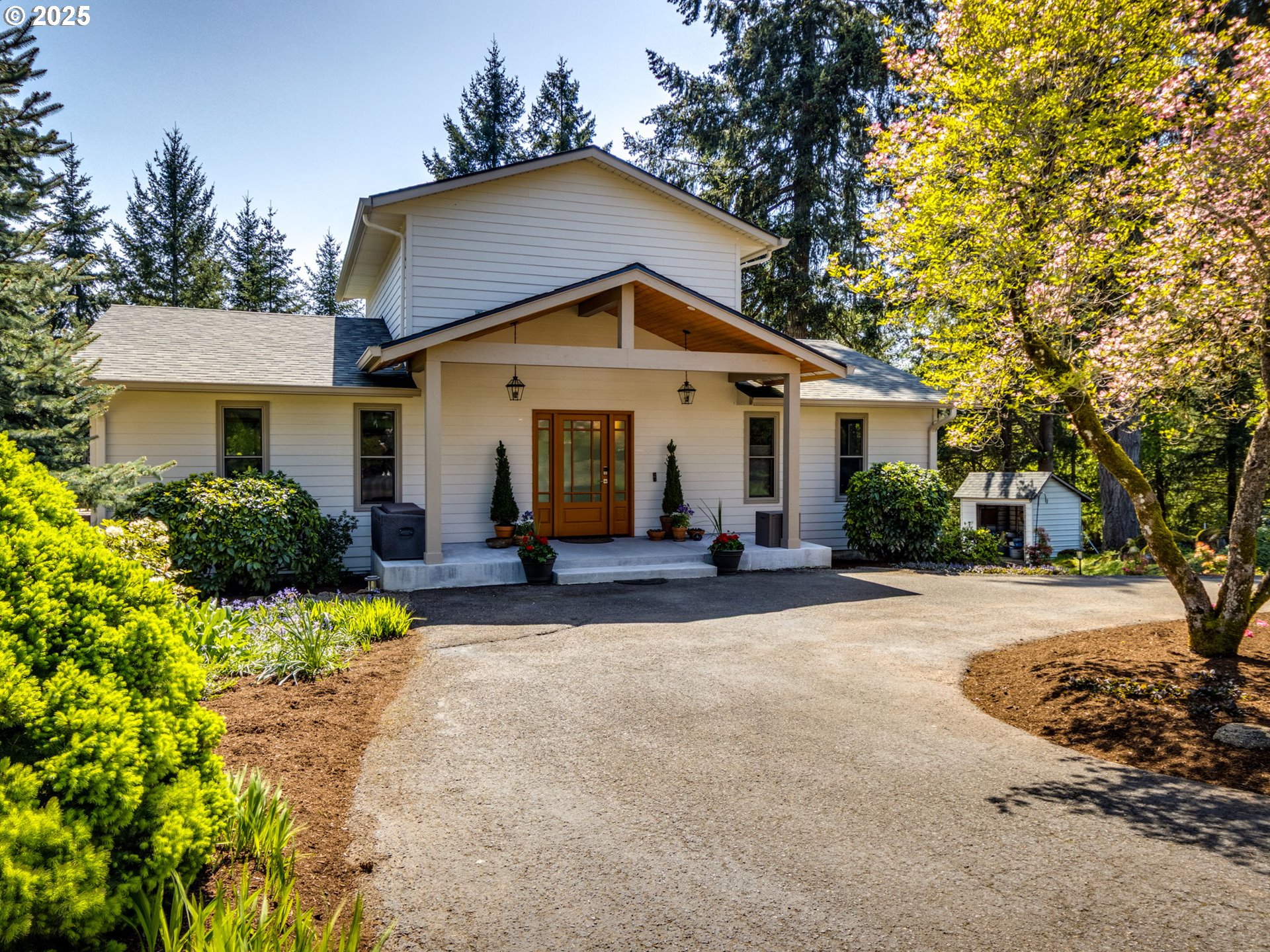12720 South Carus Road Oregon City, OR 97045 - Photo 2 of 41 a view of a house with a yard and large tree