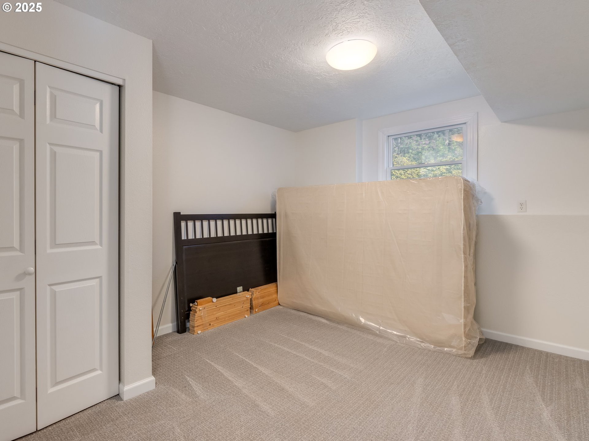12720 South Carus Road Oregon City, OR 97045 - Photo 22 of 41 a bedroom with a bed and a table