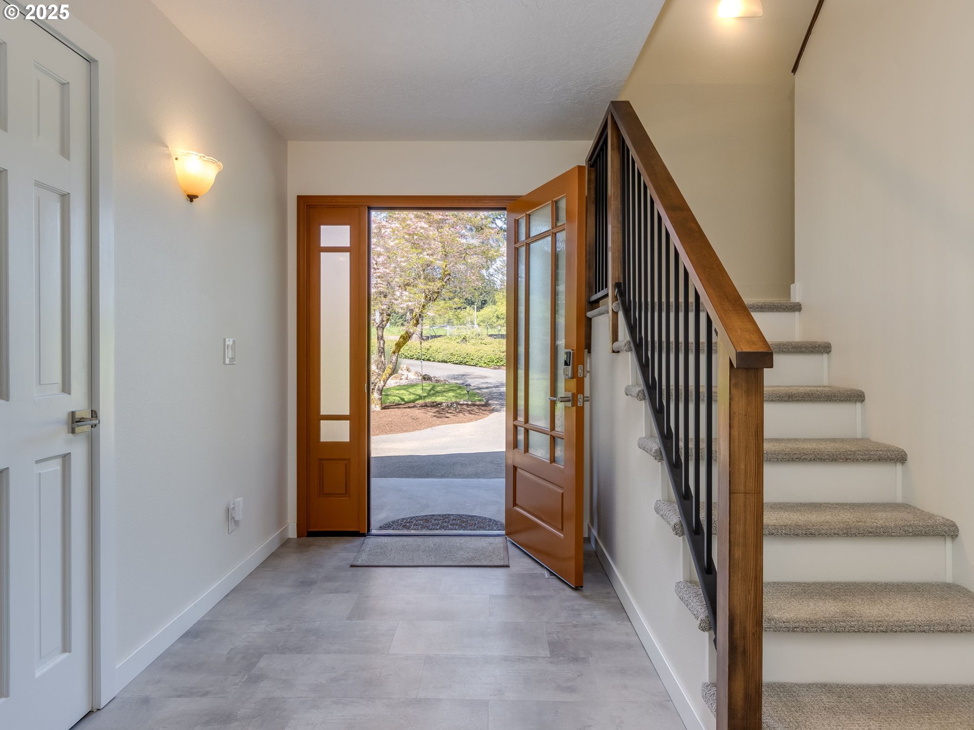 12720 South Carus Road Oregon City, OR 97045 - Photo 4 of 41 a view of an entryway with staircase