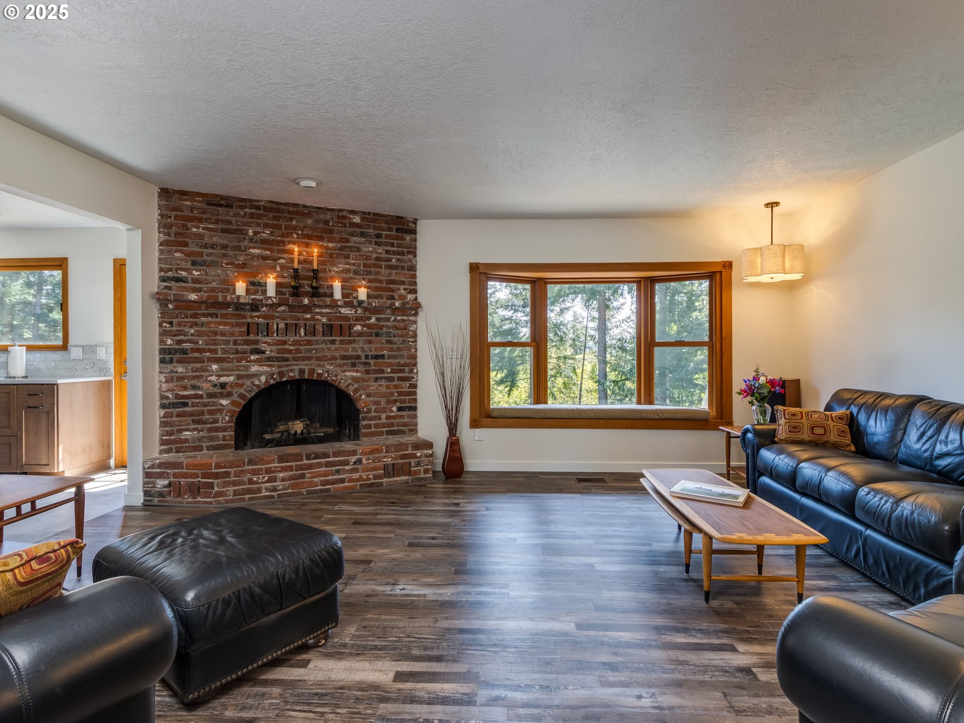 12720 South Carus Road Oregon City, OR 97045 - Photo 5 of 41 a living room with furniture a large window and a fireplace