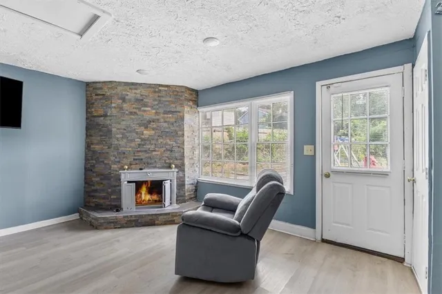 a view of a livingroom with furniture and a flat screen tv