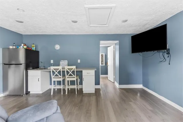 a kitchen with refrigerator and car