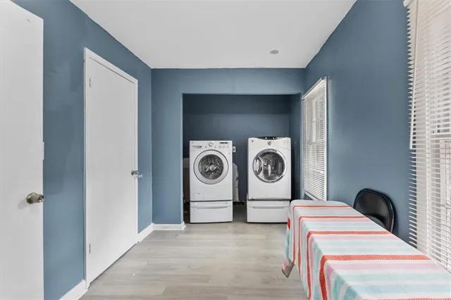 a kitchen with granite countertop white cabinets and appliances