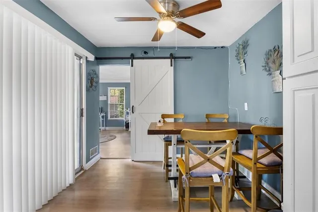 a view of a livingroom with furniture and a window
