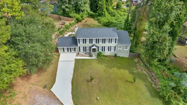 front view of a house with a yard