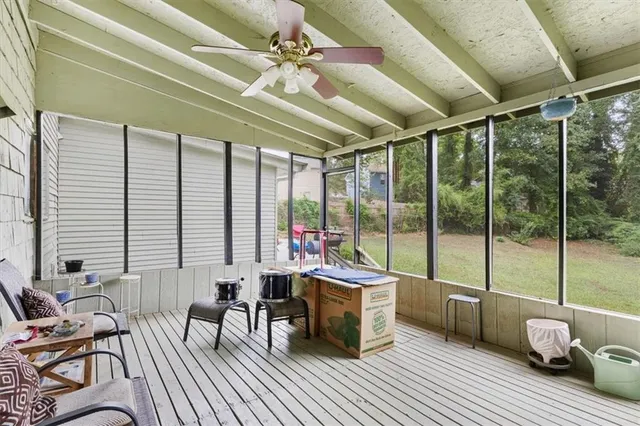 an aerial view of residential house with green space