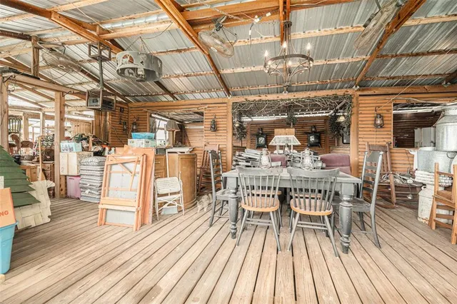 a view of a chairs and table on the wooden floor