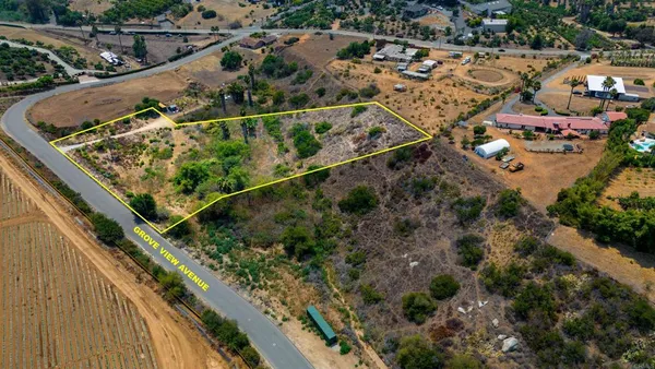 a view of a yard with a wooden deck