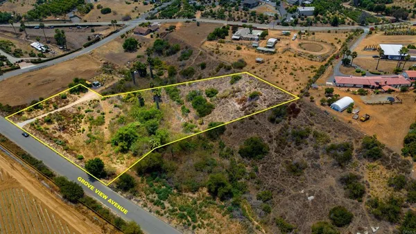 a view of a yard with a wooden deck