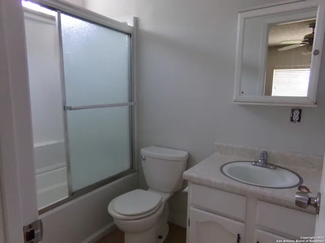 a bathroom with a toilet and a sink