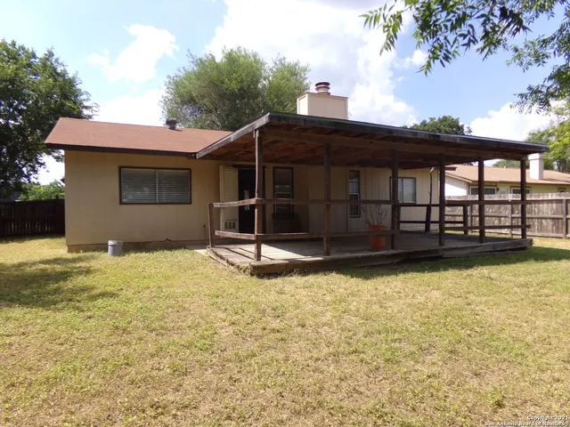 a backyard of a house with yard and garage