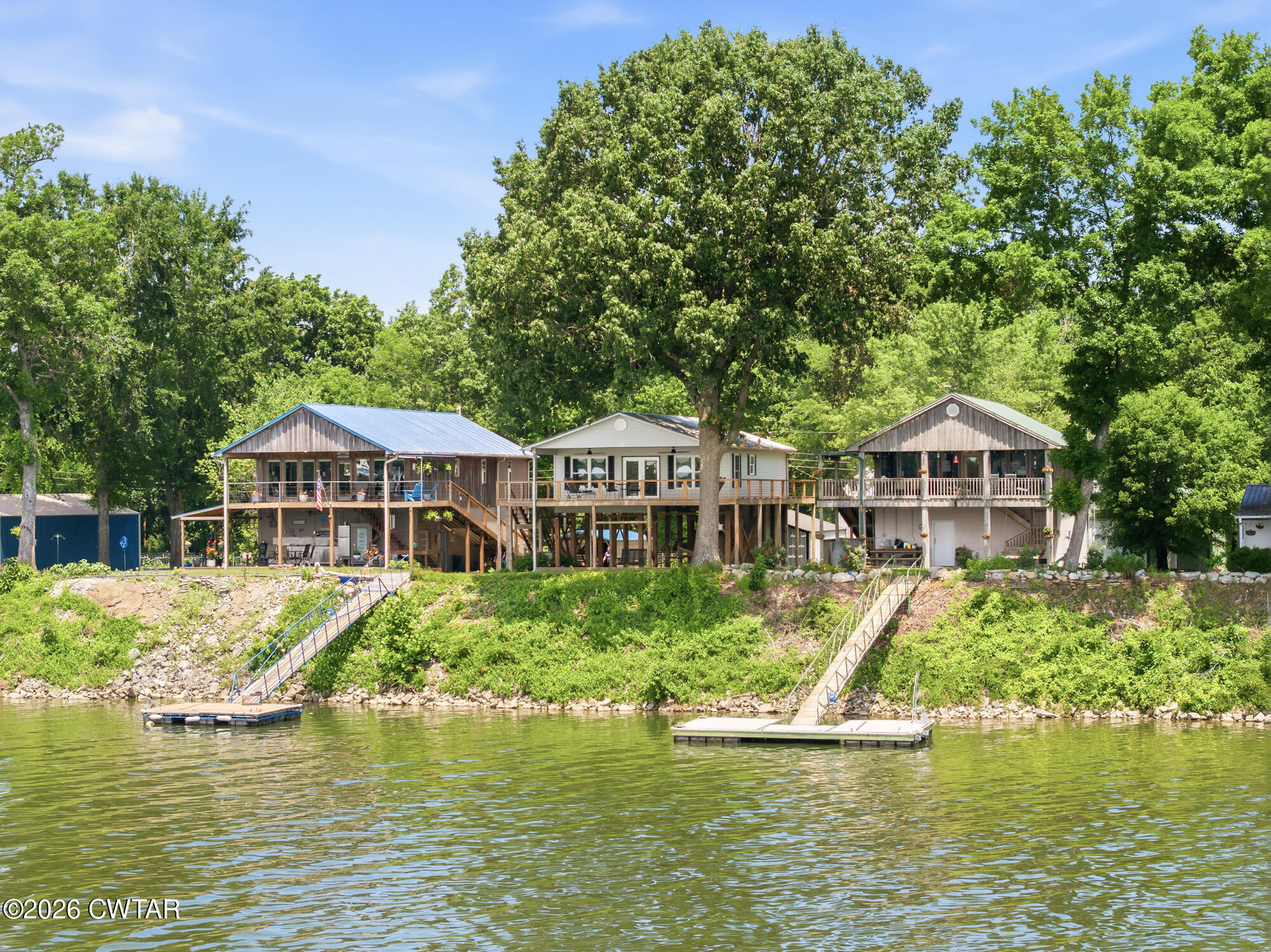 1728 Yarbro Landing Lane Decaturville, TN 38329 - Photo 21 of 44 a front view of a house with a boat