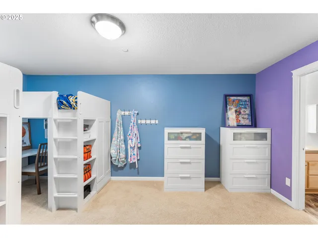 a utility room with stainless steel appliances wooden floor and stuff