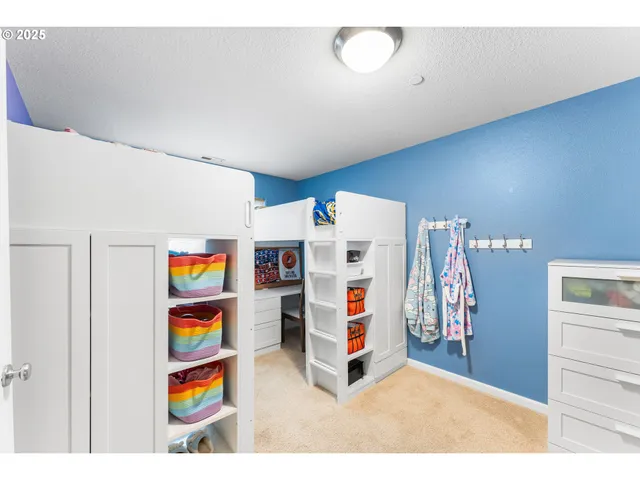 a kitchen with a refrigerator and a stove