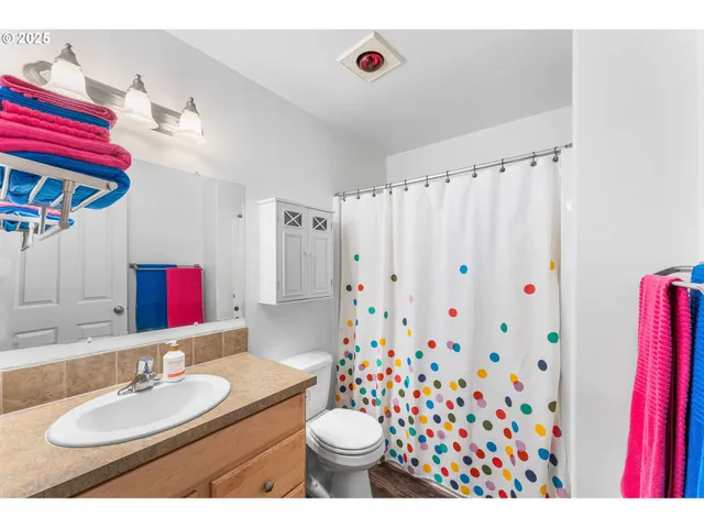 a view of a chair and table in the backyard