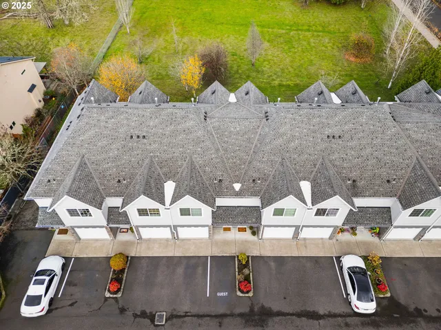 an aerial view of a house with swimming pool
