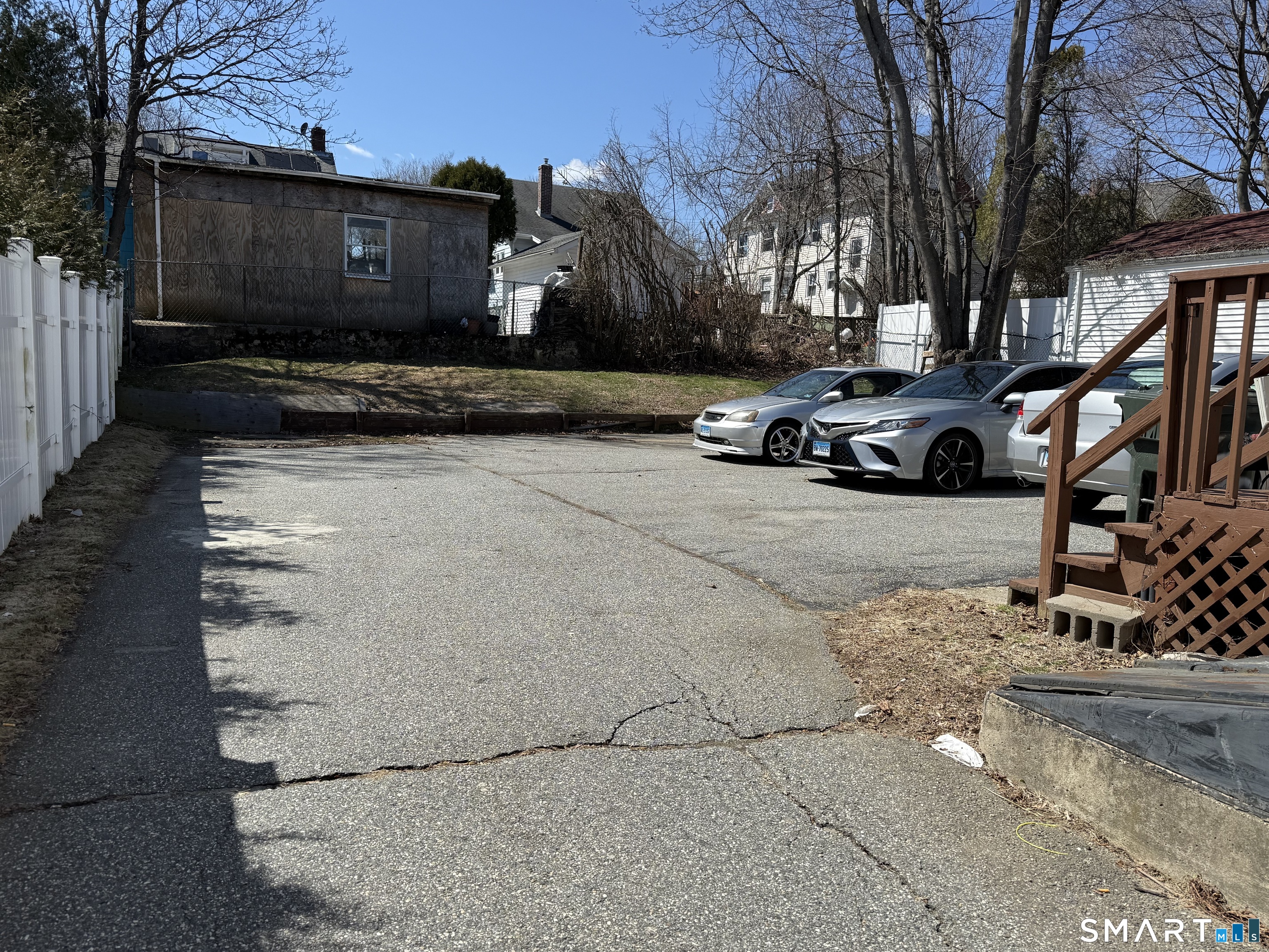 90 Summer Street New London, CT 06320 - Photo 3 of 10 a view of a street with a cars park side of a road