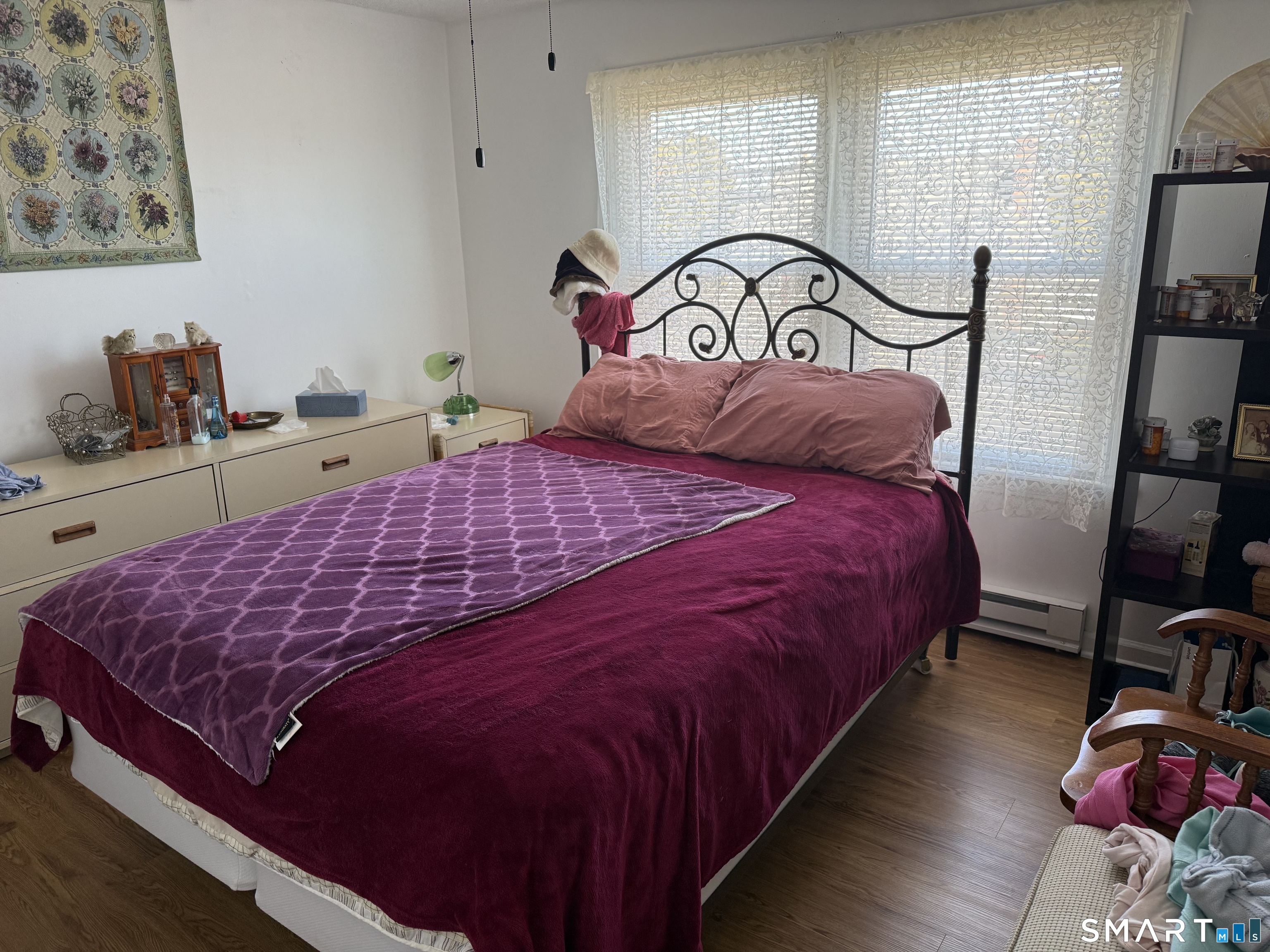 90 Summer Street New London, CT 06320 - Photo 6 of 10 a bedroom with a bed and a flat tv screen on the dresser