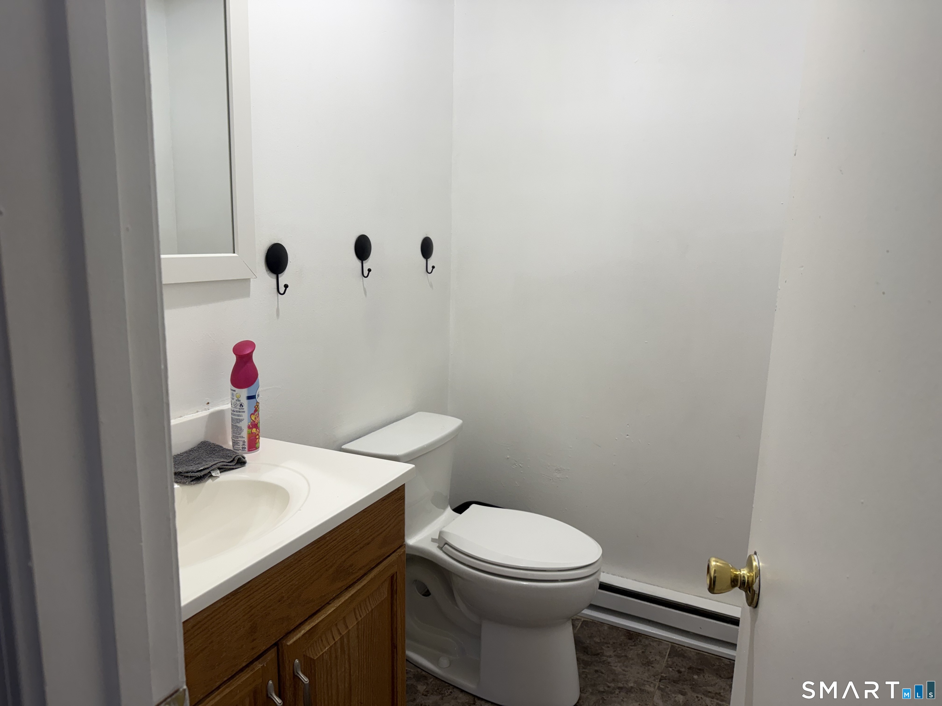 90 Summer Street New London, CT 06320 - Photo 8 of 10 a bathroom with a sink a toilet and a mirror