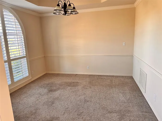 an empty room with windows and entrance