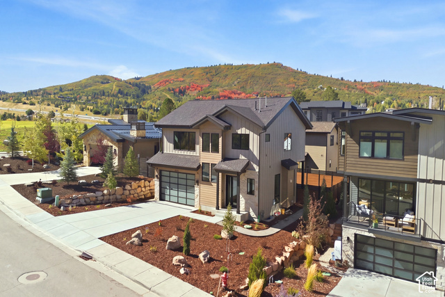 4092 Discovery Way Park City, UT 84098 - Photo 56 of 66 Modern architectural style with a multi-paneled garage door and a paved driveway