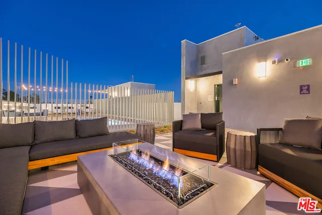 a view of a chairs and table in the patio