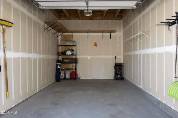 a view of empty room with wooden walls