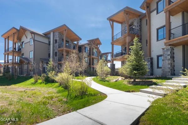 a front view of house and yard with green space