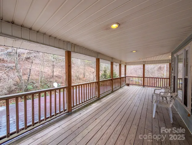 a view of balcony with wooden floor
