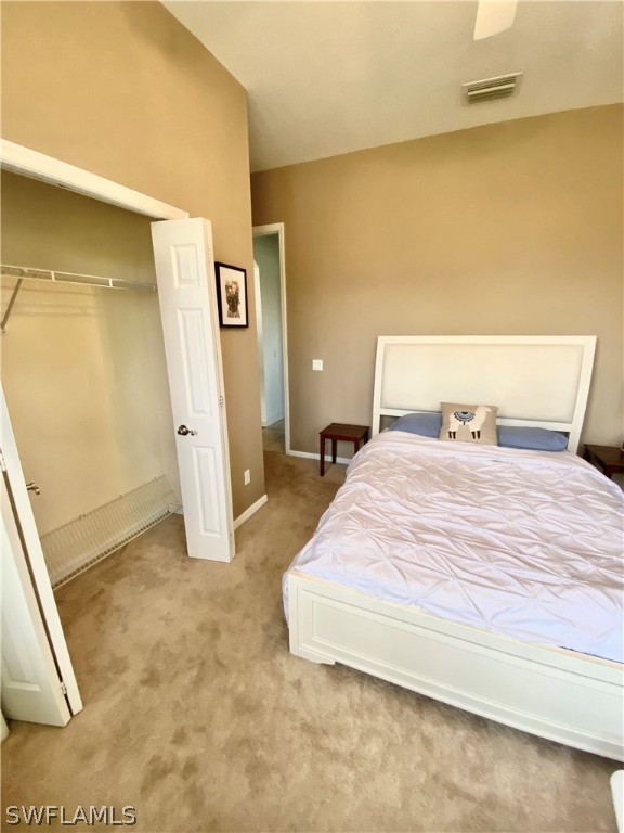 9012 West Ridge Court Fort Myers, FL 33912 - Photo 13 of 23 a bedroom with a bed and a cabinets